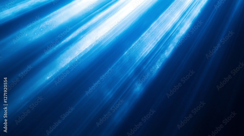 Poster Bright sunlight filters through the deep blue waters, creating a mesmerizing dance of light and shadows below the surface. The ocean's serenity is enhanced by the shimmering rays