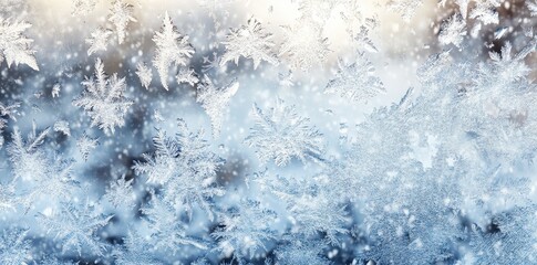 Intricate patterns of frost crystals form delicate designs on glass