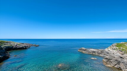 Serene Seascape with Clear Blue Water and Rocky Coastline