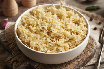 Fermented cabbage or sauerkraut in a white bowl