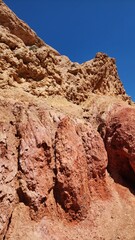 Fototapeta premium Scenic View of Fary Tale Canyon, Issyk-Kul, Kyrgyzstan- Stunning Red Rock Formations.