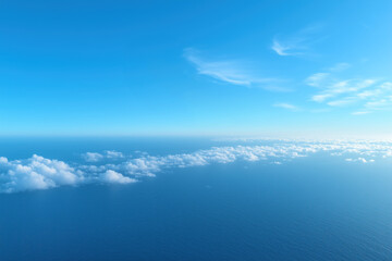 Obraz premium Aerial view of beautiful blue sea and sky with clouds.