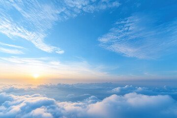 Obraz premium Beautiful aerial view above the clouds at sunset. View from airplane window.