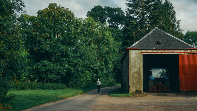 runner and old farm barn