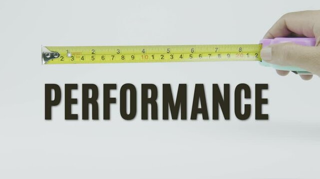 "Performance" text with a yellow tape measure on a white background, symbolizing precision, accuracy, and the measurement of efficiency, achievement, or progress in a clean, minimal video