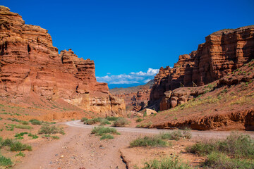 Fototapeta premium Charyn Canyon, Valley of Castles. The excellence of Kazakhstan. Panorama of natural unusual landscape. The red canyon of extraordinary beauty looks like a Martian landscape.