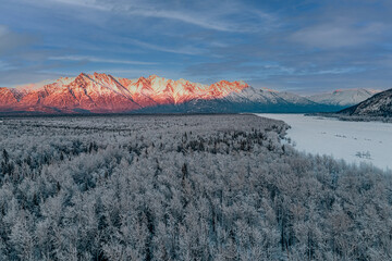 Aerial View of Chugach Mountains at Sunset with Alpenglow, Frost Covered Forest and Frozen Knik...