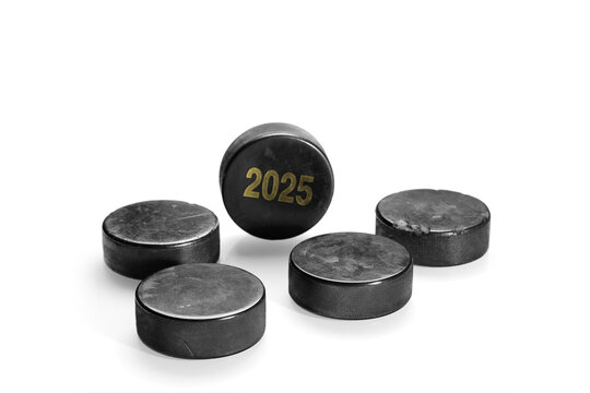 Hockey pucks on white