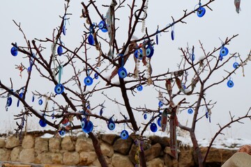 The tree is decorated with the Blue Eye Amulet (Nazar Boncuğu), a very popular amulet in Turkey.