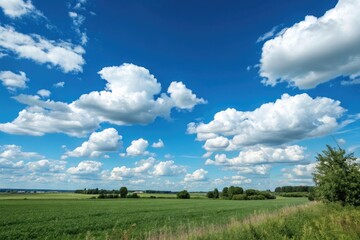 Obraz premium clouds drifting lazily across a bright blue sky, countryside view, white clouds, sunny weather, cloudy day
