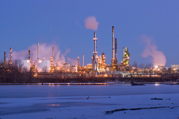 oil and petroleum refinery along frozen mississippi river in saint paul park minnesota at night