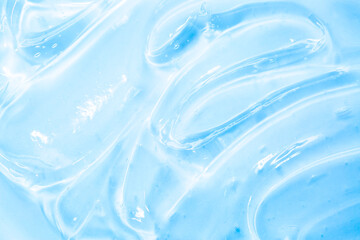 Cosmetic gel, serum transparent sample. Liquid cream with bubble texture. Gel texture of a cosmetic product. Clear liquid lotion for skin care.