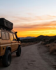Off-Road Adventure Vehicle Against Scenic Sunset Landscape on Desert Trail