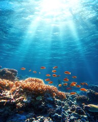 Obraz premium Underwater Scene with Sunlight Rays Illuminating Coral Reefs and Tropical Fish in Clear Blue Ocean Water