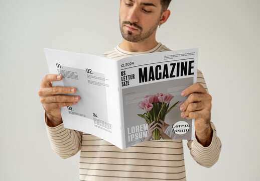 Mockup Of Man Reading Customizable Magazine