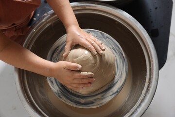 Hobby and craft. Girl making pottery indoors, above view