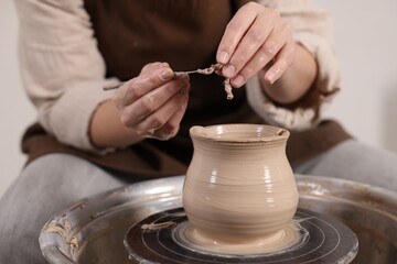 Hobby and craft. Woman making pottery indoors, closeup