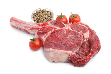 Piece of raw beef meat, spices and tomatoes isolated on white