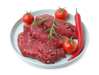 Pieces of raw beef meat, spices and tomatoes isolated on white