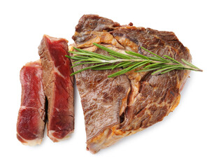Pieces of delicious beef meat and rosemary isolated on white, top view