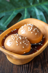 Two ajitsuke tamago ramen eggs marinated with soy sauce and sesame seeds