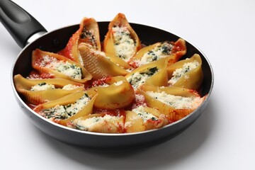 Delicious shell pasta stuffed with ricotta and spinach isolated on white