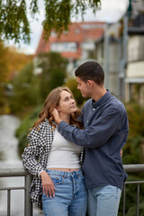 Obraz premium Young Cute Female Hugs Boyfriend. In Autumn Outdoor. Lovers Walking in Park. Attractive Funny Couple. Lovestory in Forest. Man and Woman. Cute Lovers in the Park. Family Concept. Happy Couple.