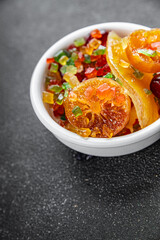 Candied peel and fruit orange, kumquat, tangerine, cherry, mango and others Sugar-coated fruit fresh tasty food dish delicious gourmet food background on the table rustic food top view copy space