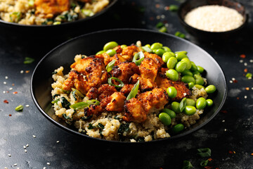 Sweet and sour tofu with spinach quinoa and steamed edamame beans. Healthy food.