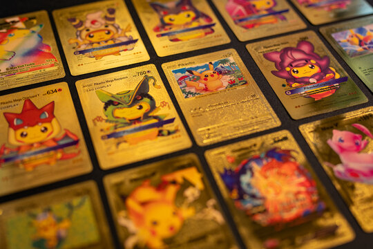 Pokemon Golden Cards Flat Lay Gold on Black Background Shallow Depth of Field