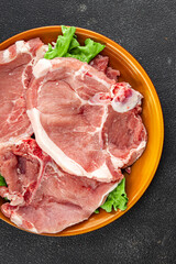 Raw pork on bones meat fresh tasty food dish delicious gourmet food background on the table rustic food top view copy space