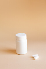 white pills with a glass of water