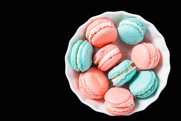 White plates with color macaroons.