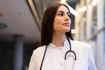 Portrait of a young Latina doctor in a white coat