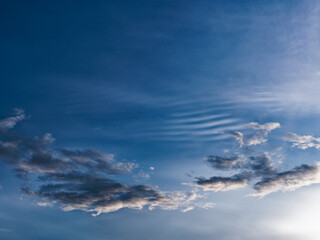 Blue sky with unusual cloud patterns, UK