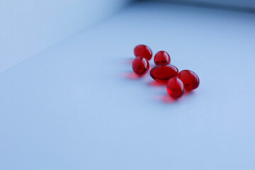 red capsules on a white background