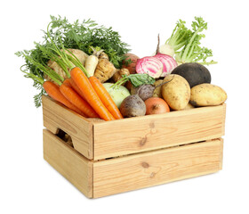 Different root vegetables in wooden crate isolated on white