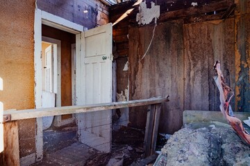 Decaying interior of an abandoned house. Damaged walls and peeling paint. Ruined structure. , Kaitaia, Northland, NZ