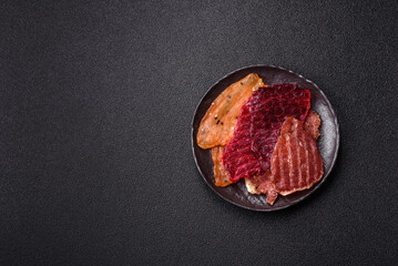 Jerky, dried meat in the form of slices with salt, spices and herbs