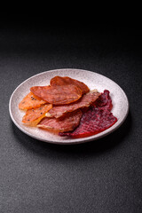 Jerky, dried meat in the form of slices with salt, spices and herbs