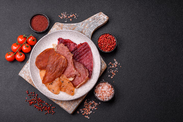 Jerky, dried meat in the form of slices with salt, spices and herbs