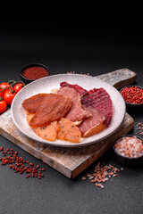 Jerky, dried meat in the form of slices with salt, spices and herbs