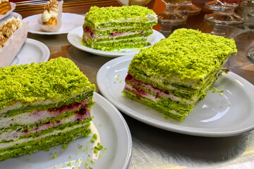 Layers of delight in a vibrant dessert showcasing green and pink hues