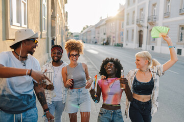 Friends walking down the street during pride month celebration