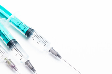 A medical syringe with a needle, used for injections and vaccinations. A clean and professional...