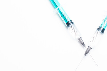 Disposable medical syringe with a needle on a white background. Ideal for injections, vaccines, and...