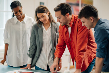 Marketing team analyzing pie chart during business meeting