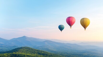 Fototapeta premium Vibrant Hot Air Balloons Floating Over Serene Mountain Landscape in Clear Blue Sky