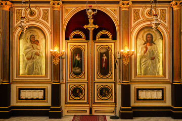 A stunning Orthodox iconostasis inside St. Nicholas Church in Kotor, Montenegro. The richly...