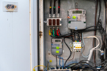 A detailed look at a complex electrical control panel with various wires, circuits, and components...